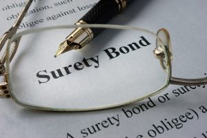 Page of newspaper with words surety bond.